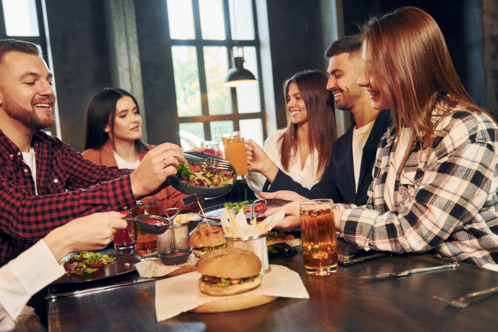 What Makes a Bar or Restaurant Unique? 37 at daytime group of young friends sitting togethe 2021 12 27 17 03 49 utc scaled