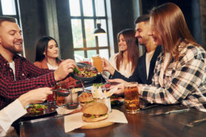 What Makes a Bar or Restaurant Unique? 2 at daytime group of young friends sitting togethe 2021 12 27 17 03 49 utc scaled