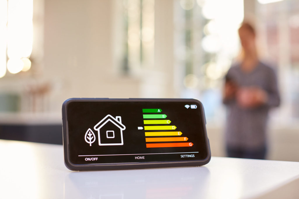 Tips for Making Your Home More Energy Efficient 36 Smart Energy Meter In Kitchen Measuring Energy Efficiency With Figure In Background