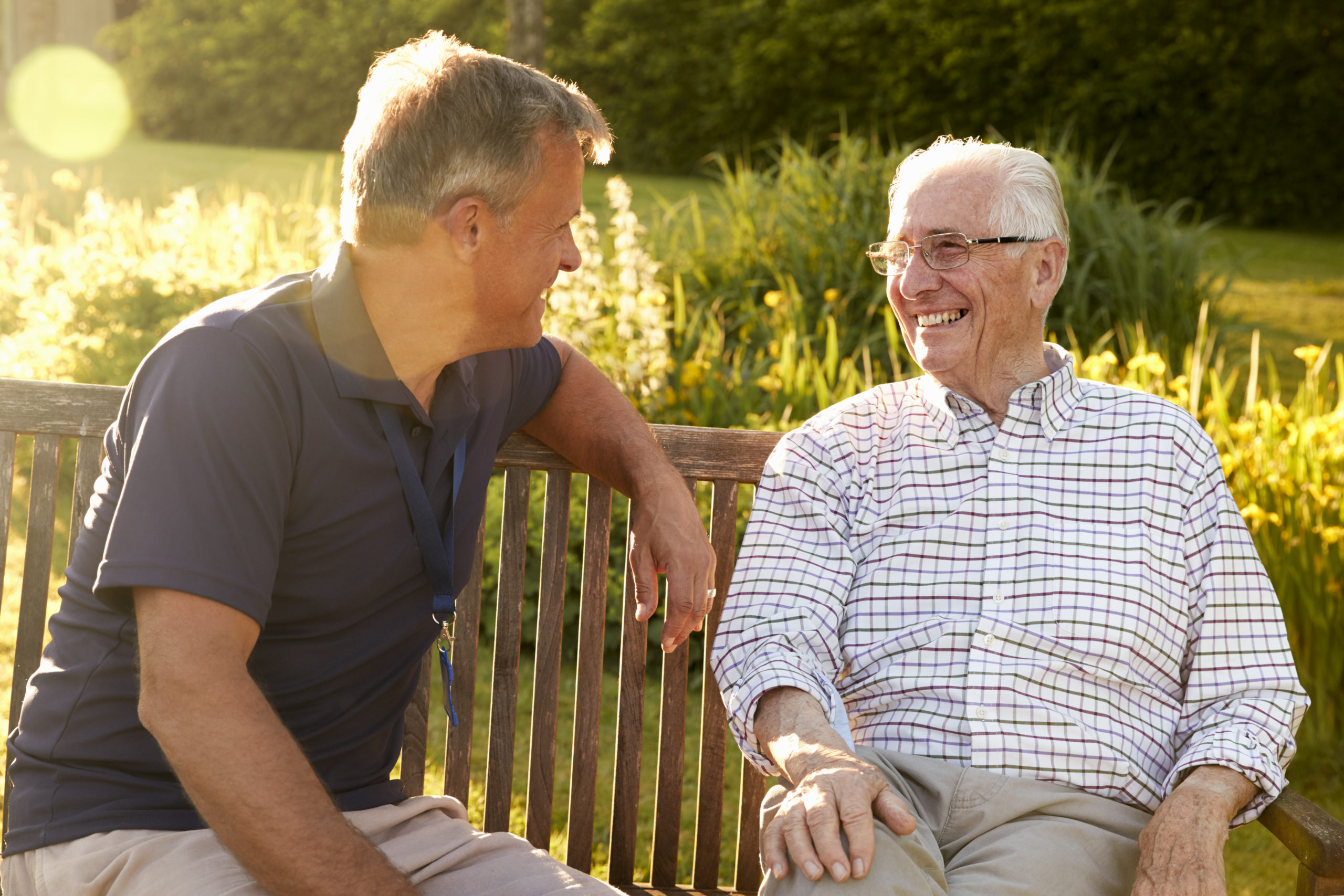 Man Visiting Senior Male Relative In Assisted Living Facility