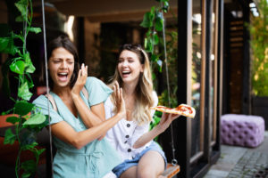 Woman rejecting unhealthy fast food because of gluten intolerance